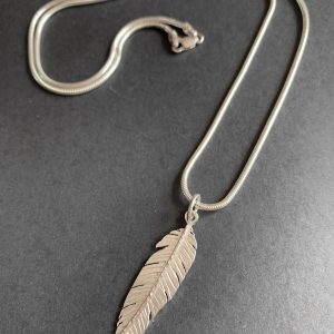 Silver feather pendant on a chain