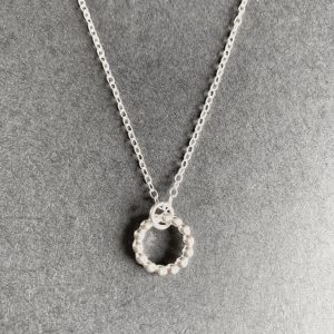 Silver beaded circle pendant