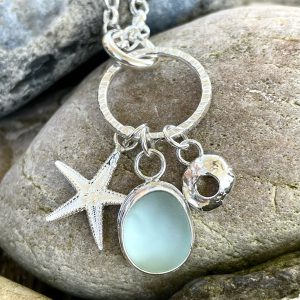 Silver Charm necklace with starfish, sea glass and hag stone